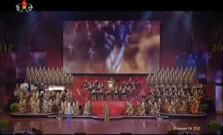 Footage has emerged of a rousing classical concert in North Korea featuring images that appear to show a nuclear bomb being dropped on America.