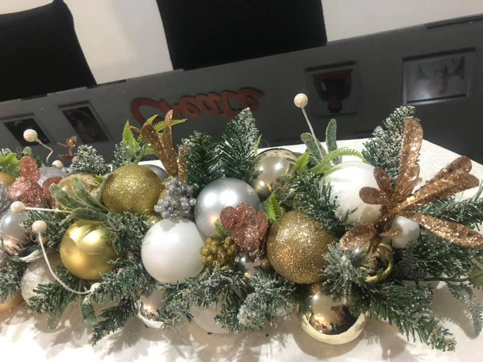Image of Kmart pool noodle trend arrangement with bronze, gold and silver baubles