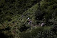 The Wider Image: Doctors scale rockslides, invoke gods to vaccinate Himalayan villages