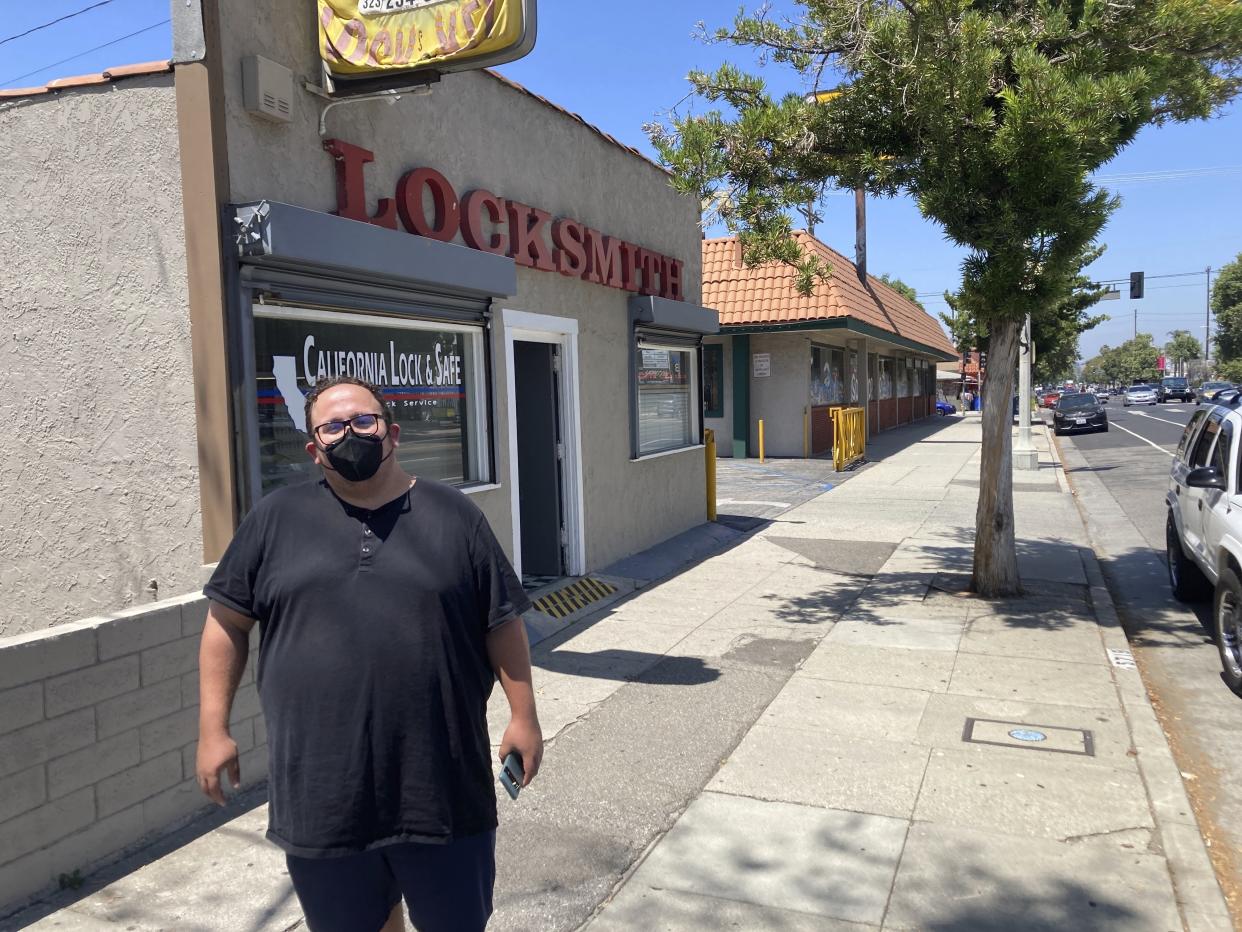 Nick Barragan wears a mask while running errands in Los Angeles on Wednesday, July 13, 2022. (AP Photo/Christopher Weber)