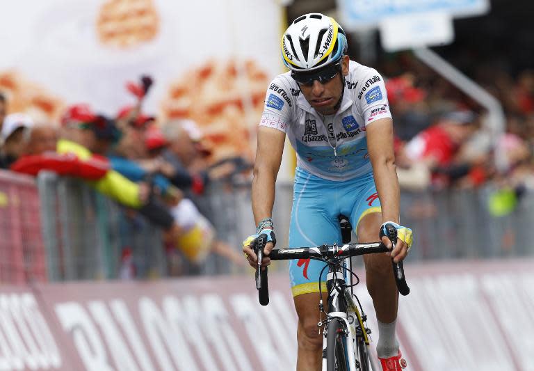 Italian rider Fabio Aru (Astana) crosses the finish line of the 16th stage of the 98th Giro d'Italia, Tour of Italy, cycling race between Pinzolo and Aprica on May 26, 2015 in Aprica