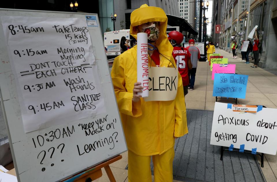 Teacher Andrew Van Herik protests outside Chicago Public Schools headquarters on Wednesday, July 22, 2020.