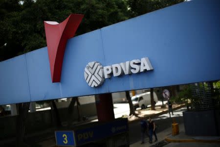 FILE PHOTO: The corporate logo of the state oil company PDVSA is seen at a gas station in Caracas, Venezuela, August 30, 2017. REUTERS/Andres Martinez Casares/File Photo