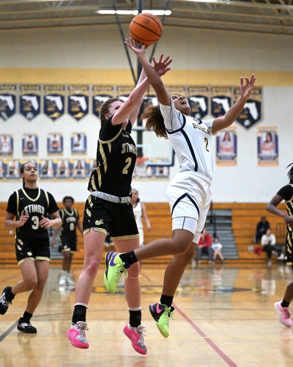 Boca Raton's Taty Campise-Pinkney goes up for a contested shot in the paint during a regional semifinals match against Miami on Feb. 19, 2024.