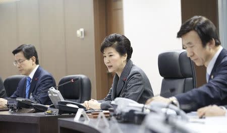 South Korean President Park Geun-hye (C) presides over the National Security Council at the Presidential Blue House in Seoul, South Korea, in this handout picture provided by the Presidential Blue House and released by Yonhap on January 6, 2016. REUTERS/Presidential Blue House/Yonhap