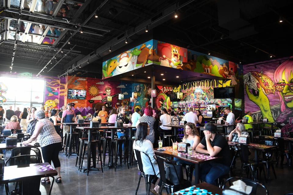 Colorful murals line the walls at Condado Tacos in Turkey Creek. The restaurant seats about 225 with an outdoor patio.