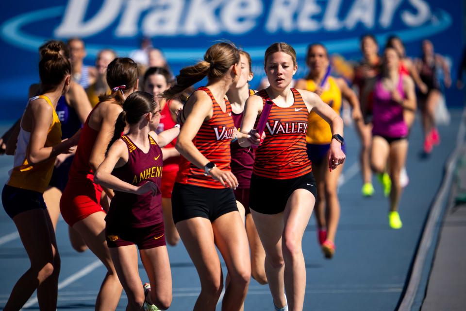 Valley's Addison Dorenkamp, right, hands off the baton during the 4x800 at the Jim Duncan Invitational on April 13 at Drake Stadium. Dorenkamp will be back at the blue oval this week for the Drake Relays.