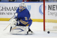 Buffalo Sabres goaltender Dustin Tokarski (31) makes a save during the second period of an NHL hockey game against the Seattle Kraken, Monday, Nov. 29, 2021, in Buffalo, N.Y. (AP Photo/Jeffrey T. Barnes)