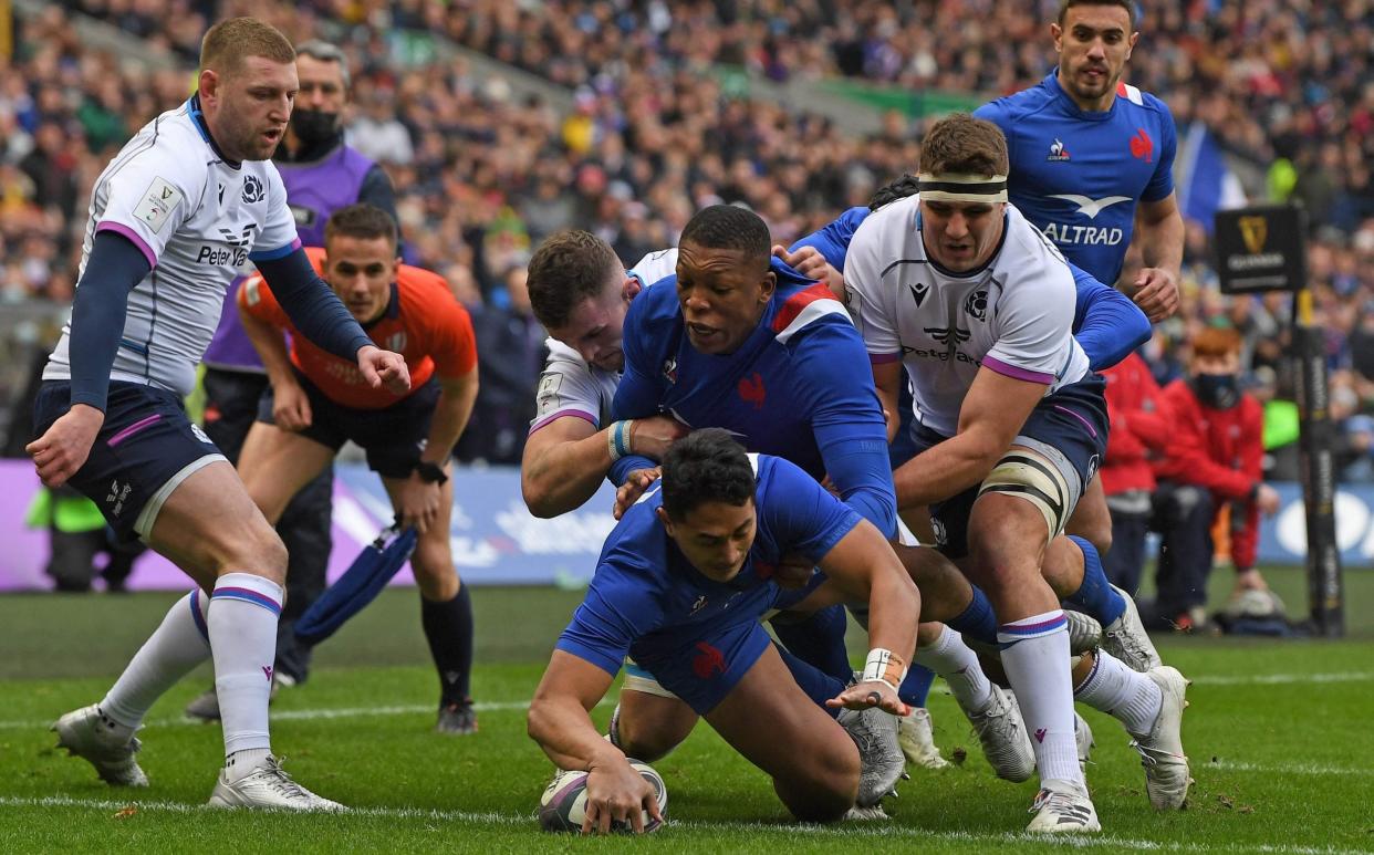 France wing Yoram Moefana scores a try against Scotland at Murrayfield in the Six Nations in 2022 - France v Scotland, Six Nations 2023: What time is kick-off and what TV channel is it on? - Getty Images/Paul Ellis