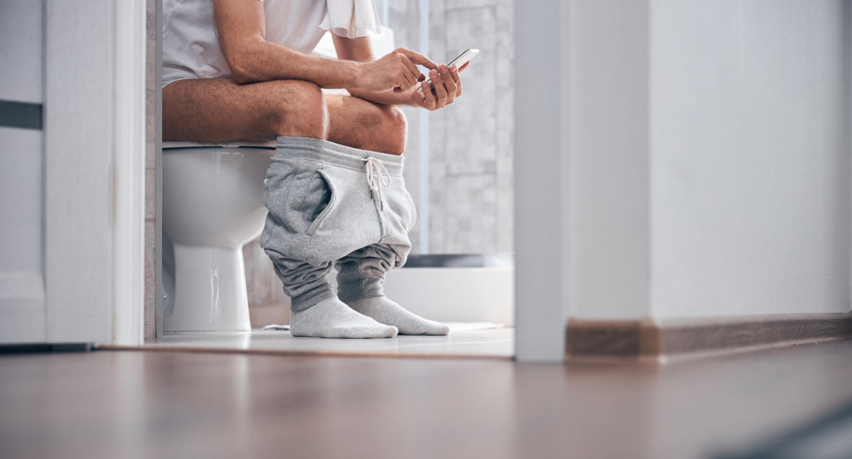 Man peeing sitting down. (Getty Images)
