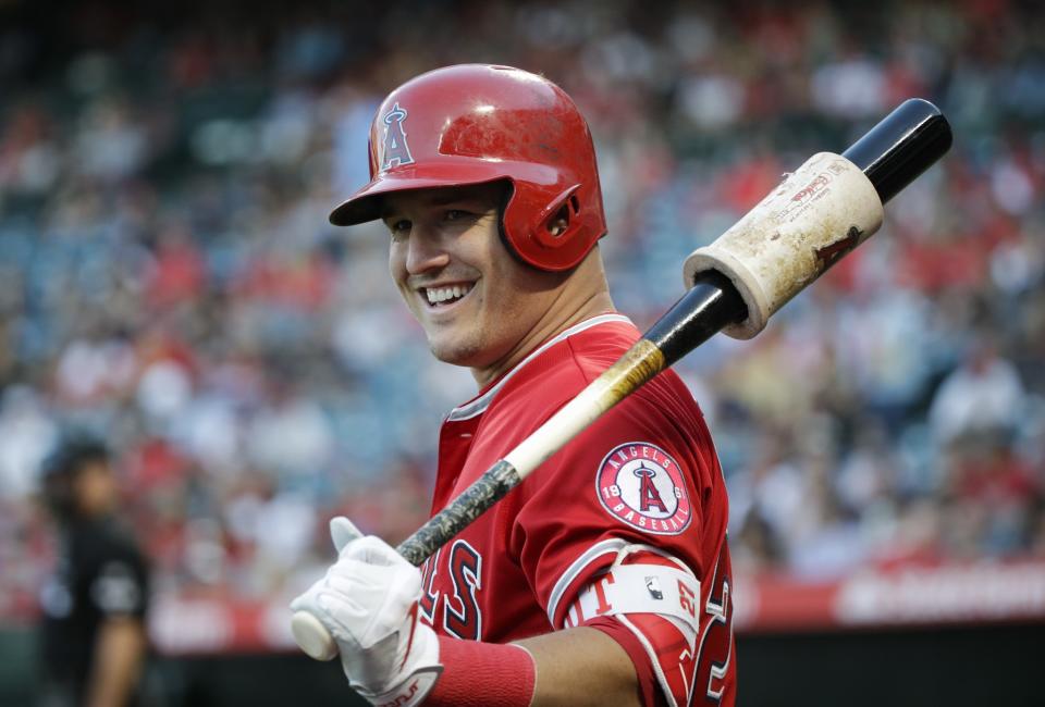 Los Angeles Angels' Mike Trout smiles while getting ready to bat during the first inning of the team's baseball game against the Tampa Bay Rays, Friday, July 14, 2017, in Anaheim, Calif.