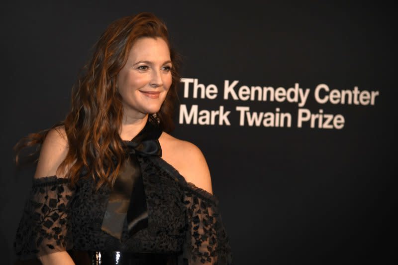 Drew Barrymore poses for photographers as she arrives on the red carpet for the 2023 Kennedy Center Mark Twain Prize for American Humor gala evening, honoring comedian Adam Sandler. File Photo by Mike Theiler/UPI