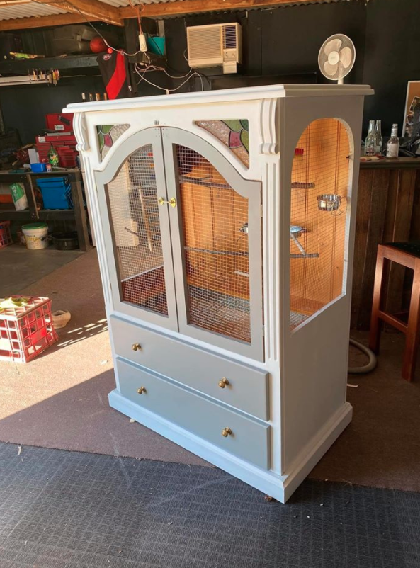 old tv unit transformed into a white birdcage