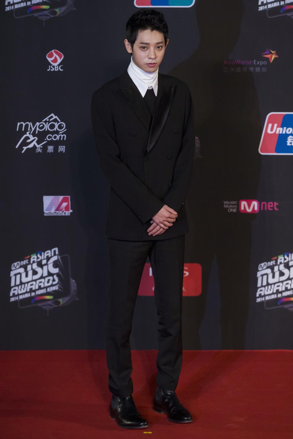South Korean singer Jung Joon-young poses on the red carpet as he attends the 2014 Mnet Asian Music Awards (MAMA) in Hong Kong