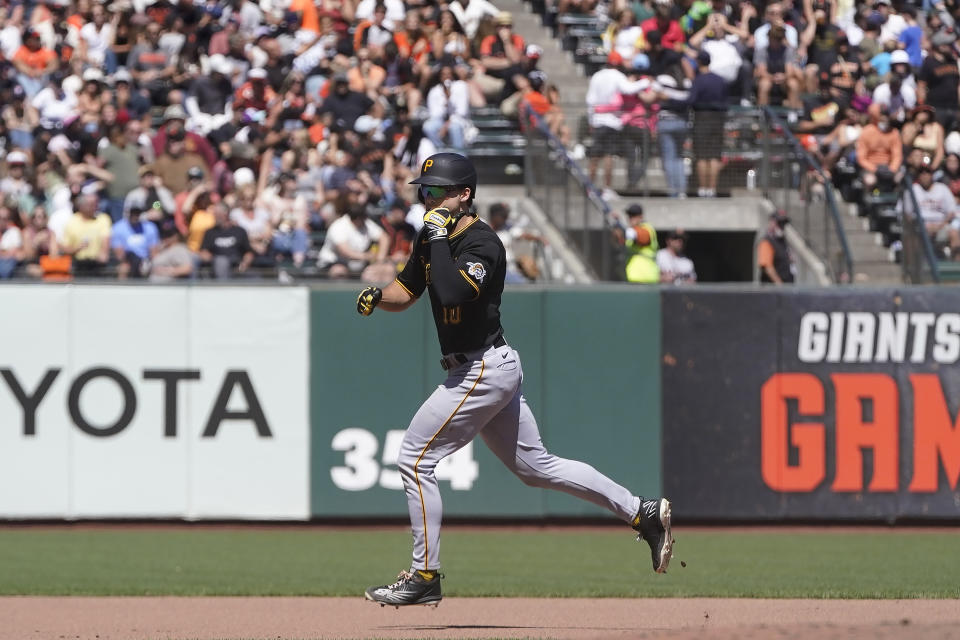 Pittsburgh Pirates' Bryan Reynolds gestures while rounding the bases after hitting a three-run home run against the San Francisco Giants during the seventh inning of a baseball game in San Francisco, Sunday, Aug. 14, 2022. (AP Photo/Jeff Chiu)