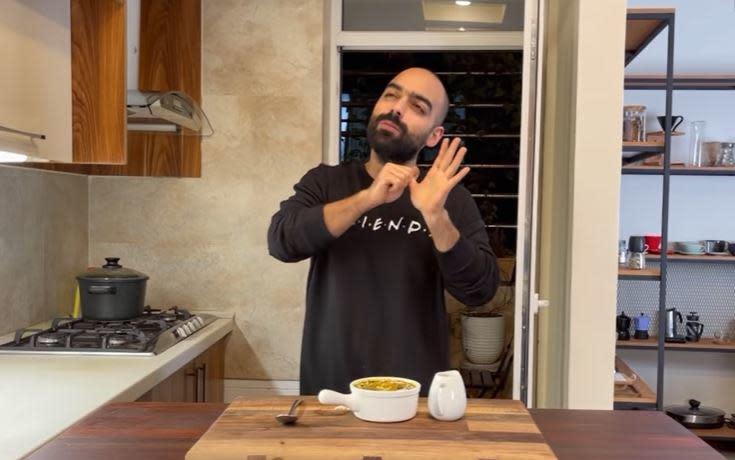 Prominent Iranian chef and Instagram influencer Navab Ebrahimi, known for his videos promoting Persian cooking, is seen in image taken from one of his YouTube tutorials. / Credit: YouTube/Navab Ebrahimi