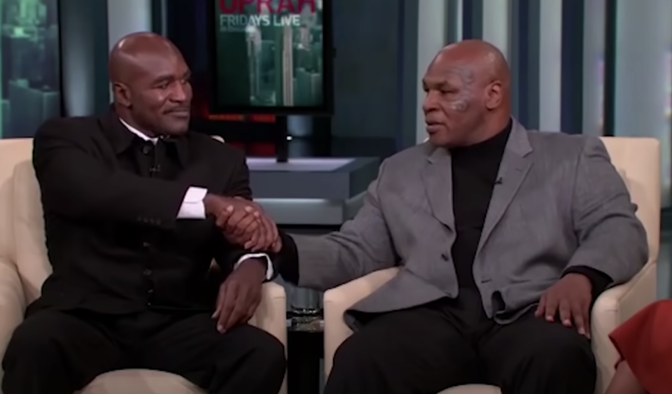 Evander Holyfield and Mike Tyson shaking hands