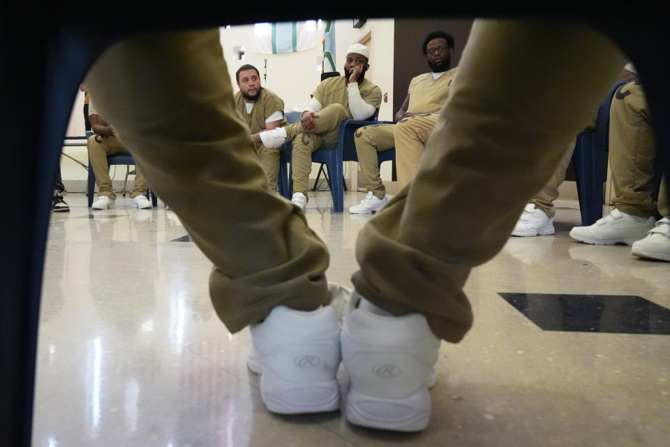 Detainees attend a book club at Department Of Corrections Division 11 in Chicago, Monday, April 22, 2024. DePaul students and detainees are currently reading Dead Man Walking and the author, anti death penalty advocate, Sister Helen Prejean attended to lead a discussion. (AP Photo/Nam Y. Huh)