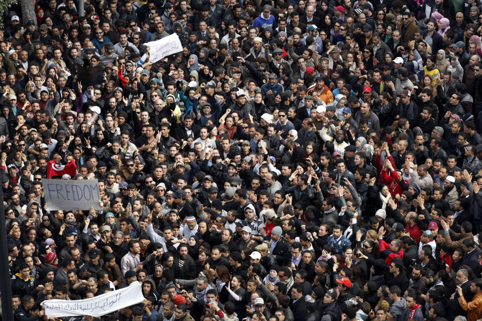 Protesters chant slogans against President Zine El Abidine Ben Ali during a demonstration in Tunis, Friday, Jan. 14, 2011. Thousands of angry demonstrators marched through Tunisia's capital Friday, demanding the resignation of the country's autocratic leader a day after he appeared on TV to try to stop deadly riots that have swept the North African nation. (AP Photo/Christophe Ena)