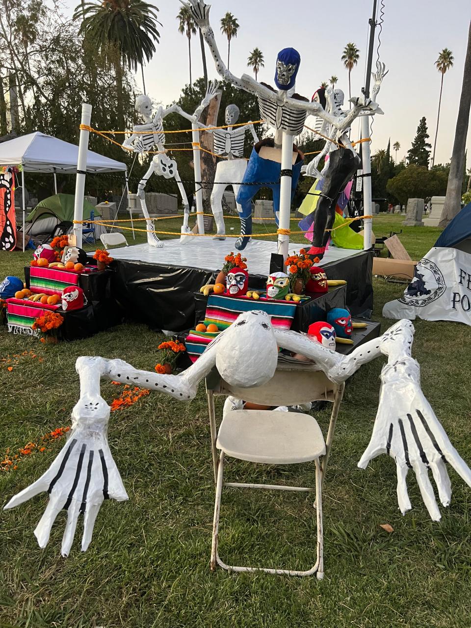 Skeleton "luchadores," or wrestlers, "fight" in a "Lucha libre" match at the Día de Los Muertos celebration at the Hollywood Forever Cemetery in Los Angeles on Saturday, Oct. 28, 2023.