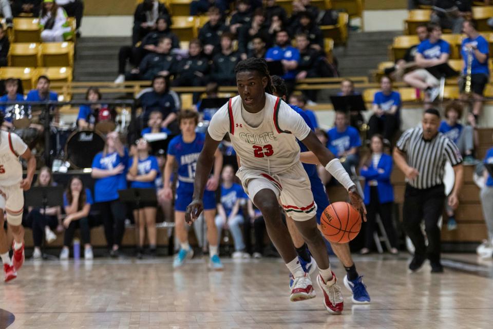 Highland Park's Jacorey Robinson dribles down the court against Andover in the quarterfinals at Emporia on Wednesday, March 6, 2024.