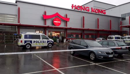 A police van is seen in front of the Herman shopping center where the Savo Vocational College is located in Kuopio