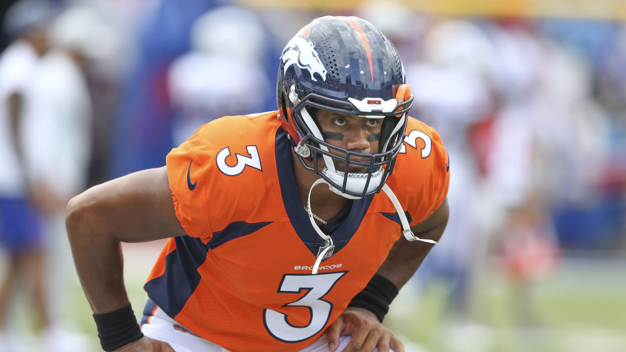 Denver Broncos quarterback Russell Wilson warms-up before a preseason NFL football game against the Buffalo Bills, Saturday, Aug. 20, 2022, in Orchard Park, N.Y. (AP Photo/Joshua Bessex)