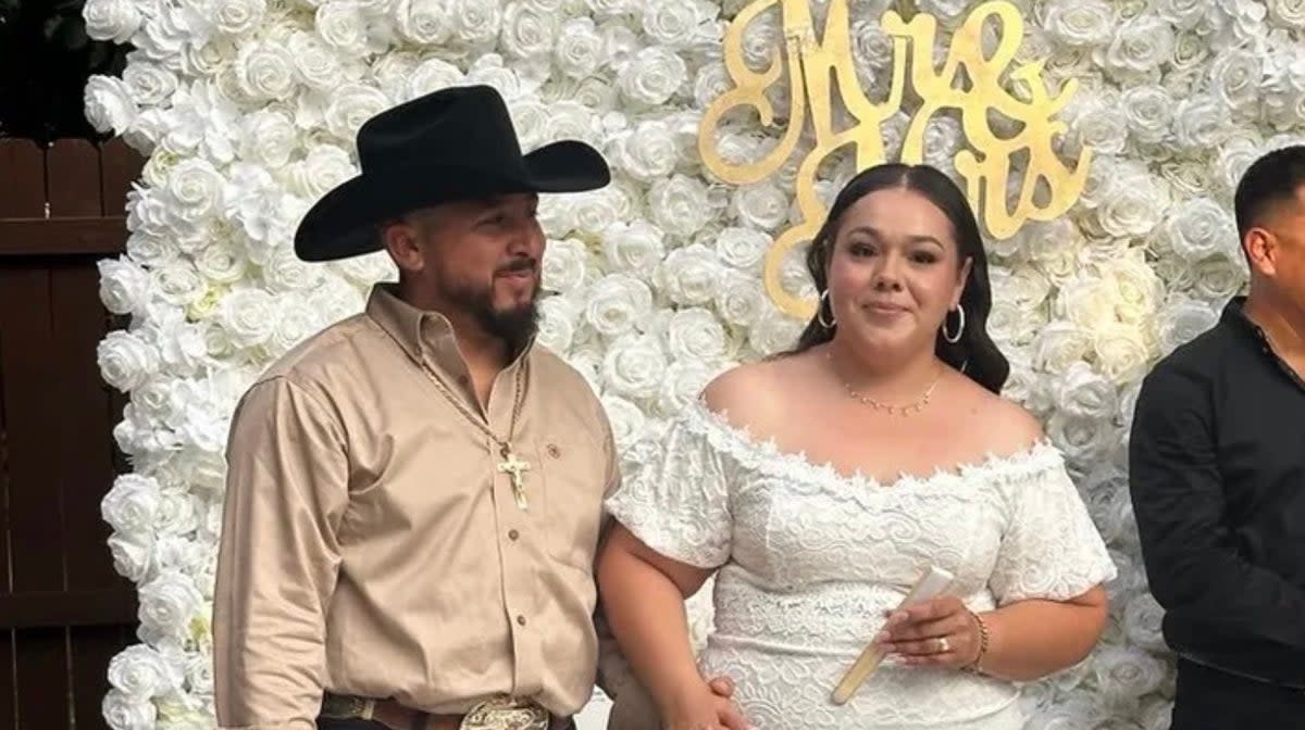 Dulce and Manuel Gonzalez at their wedding on Friday moments before gunmen stormed the event and shot the groom in the head (GoFundMe )