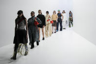 Models wear creations for the Sunnei Spring Summer 2022 collection during Milan Fashion Week, in Milan, Italy, Friday, Sept. 24, 2021. (AP Photo/Antonio Calanni)