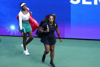 Venus Williams left, and Serena Williams, of the United States, arrive for their first-round doubles match against Lucie Hradecká and Linda Nosková, of the Czech Republic, at the U.S. Open tennis championships, Thursday, Sept. 1, 2022, in New York. (AP Photo/Frank Franklin II)