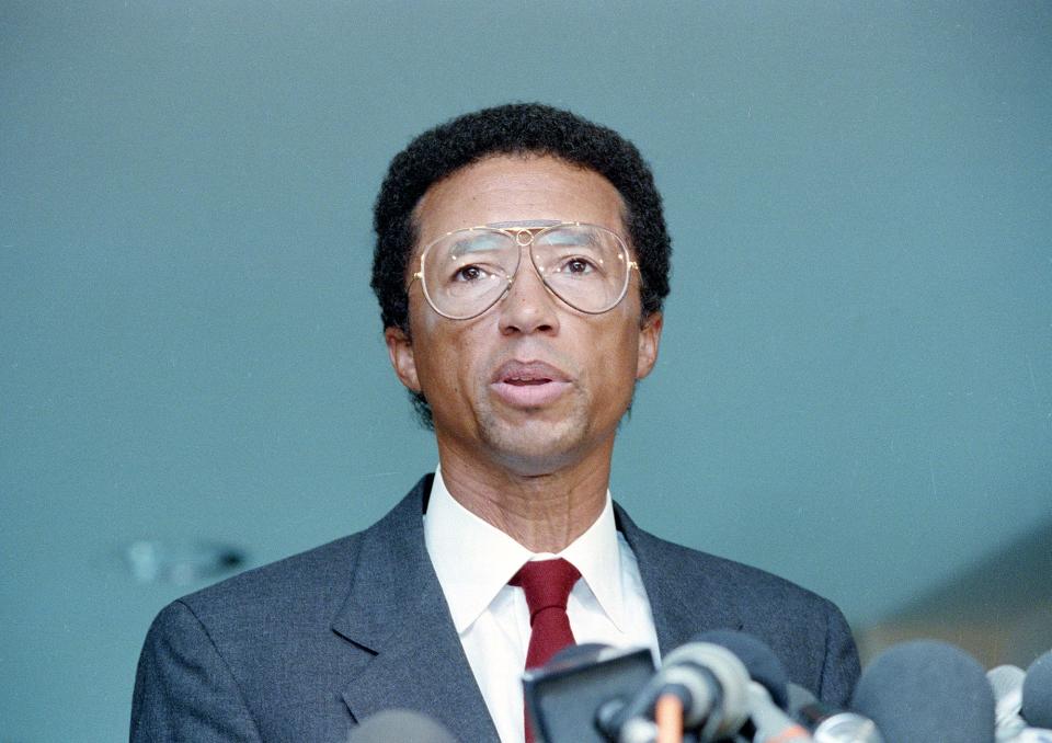 Former tennis star Arthur Ashe calls a news conference and announces he has AIDS in New York City, April 8, 1992.  Ashe, who was the first black man to win one of tennis' Grand Slam tournaments, said he contracted the HIV virus through a blood transfusion during a 1983 heart operation.  He learned of his infection in 1988. 