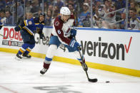 Colorado Avalanche's Erik Johnson handles the puck during the second period in Game 3 of an NHL hockey Stanley Cup second-round playoff series against the St. Louis Blues Saturday, May 21, 2022, in St. Louis. (AP Photo/Jeff Roberson)