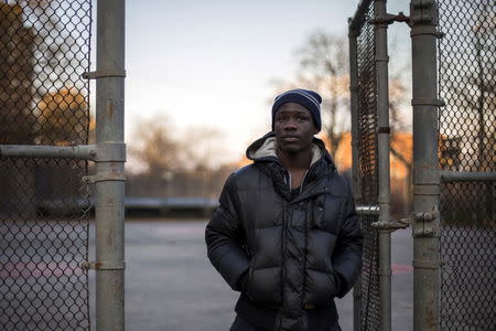 Eric, 19, who did not want to share his full name, poses for a photograph in a playground outside his residence in the Bronx borough of New York, November 20, 2014. Eric says he was 17 years-old in 2012 when he was incarcerated on Rikers Island for committing "A crime which was illegal." During a search on the school grounds where inmates attend class, Eric says he was ordered to strip naked. When he refused, he says he "Got put in a headlock, officers started beating on me, punching me in my head, my body, kicking me, had me in fetal position, stomping on me." Directly after the incident Eric says the officers "put me in flexicuffs then they (pepper) spray." Eric say he was sent to solitary confinement after the incident because officers "Said I assaulted an officer and that was that." When describing his experience at Rikers, he says "Coming from the street to there just had me on guard. Being observant and just didn't want to become a victim, which I did. After that, it just made me be more aggressive and hostile." Rikers, one of the largest jail complexes in the country which houses around 9,800 prisoners, came under scrutiny after the Justice Department in August 2014 issued a report that described a pattern of violent abuse of male inmates aged 16 to 18 by jail staff. In response to questions from Reuters, a spokesman for Rikers Island Department of Correction (DOC) said that, "Since Commissioner (Joseph) Ponte's appointment last year, he has significantly reformed the care and custody of adolescent inmates, resulting in substantial decline in violence in the adolescent facility." The spokesman added that safety for staff and inmates is Commissioner Ponte's "top priority" and that "DOC has a zero-tolerance police with regards to abuse." Reuters has been unable to independently verify the statements provided by the individual in this portrait. Picture taken November 20, 2014. REUTERS/Elizabeth Shafiroff