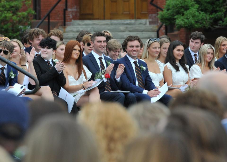 Graduates applaud during the Thayer Academy commencement ceremony in Braintree, Saturday, June 11, 2022.