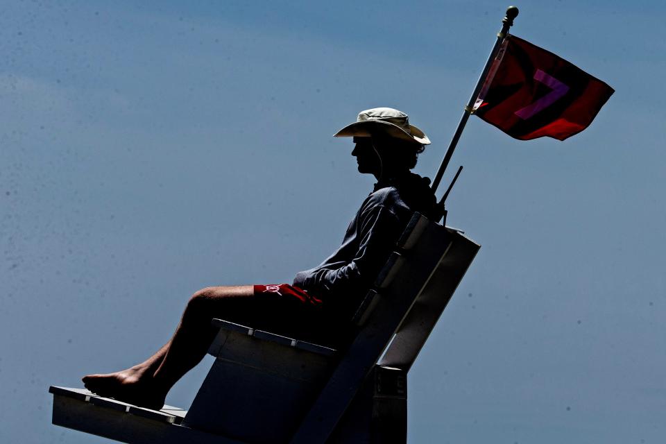 The Rehoboth Beach lifeguard keeps an eye on beachgoers on Saturday, May 27, 2023. Rip currents restricted swimmers to knee-deep entry into the ocean in selected areas of the beach.