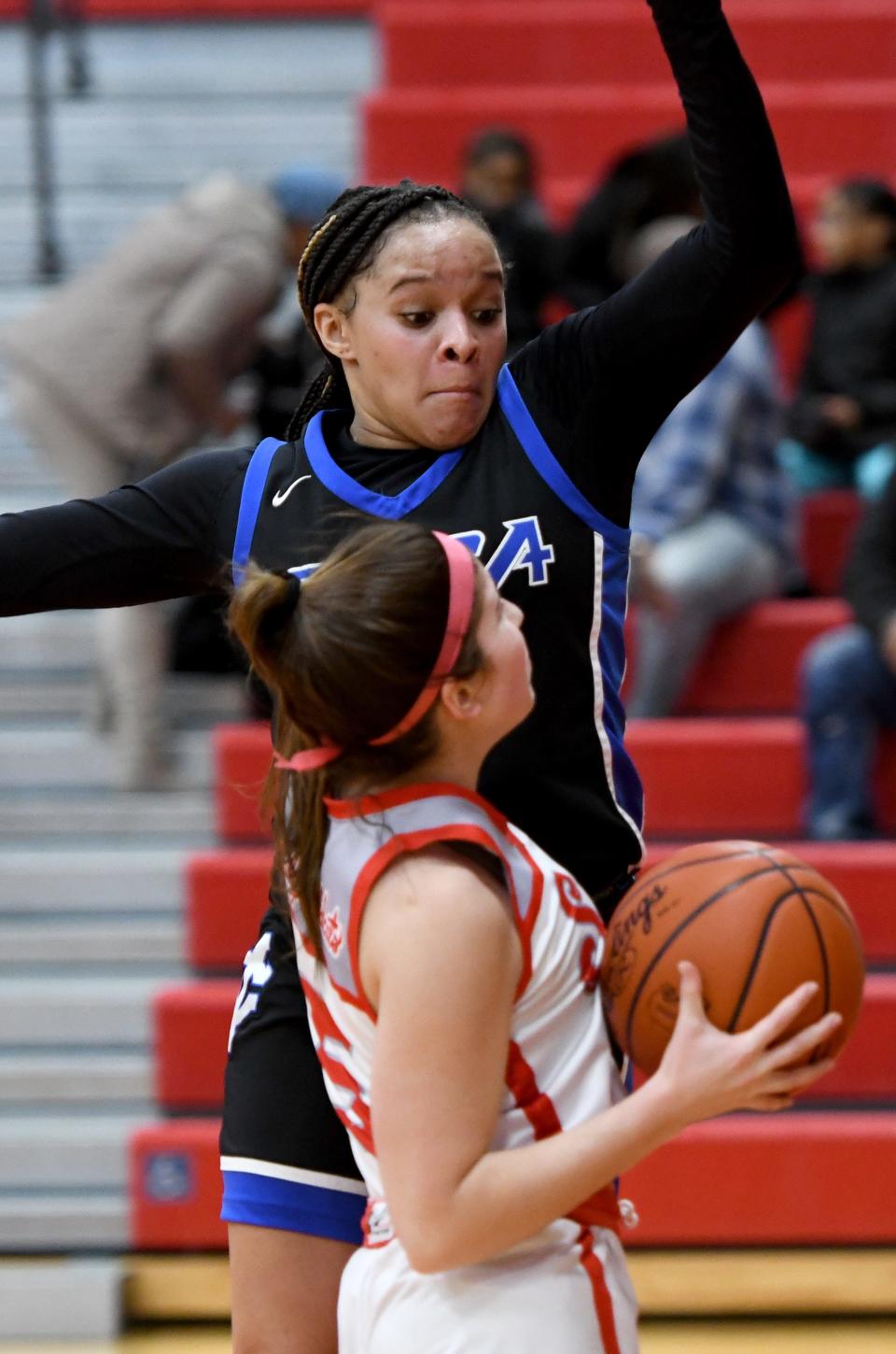 CVCA's Joi Williams leaps to defend Canton South's Abby Hein on Feb. 4, 2023, in Canton.