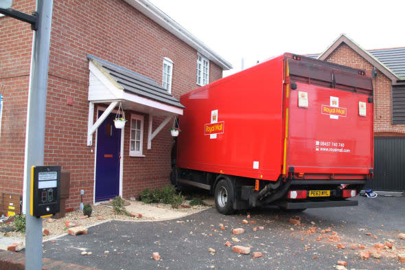 Handout photo dated 20/03/14 issued by Hampshire Fire and Rescue Service of a 7.5 tonne Royal Mail lorry that has crashed into the side of a house on Brockhurst Road, Gosport at 5.47am today, an elderly couple had to be rescued by firefighters afte they became trapped in the upstairs of the house. PRESS ASSOCIATION Photo. Issue date: Thursday March 20, 2014. See PA story ACCIDENT House. Photo credit should read: Hampshire Fire and Rescue Service/PA Wire NOTE TO EDITORS: This handout photo may only be used in for editorial reporting purposes for the contemporaneous illustration of events, things or the people in the image or facts mentioned in the caption. Reuse of the picture may require further permission from the copyright holder.