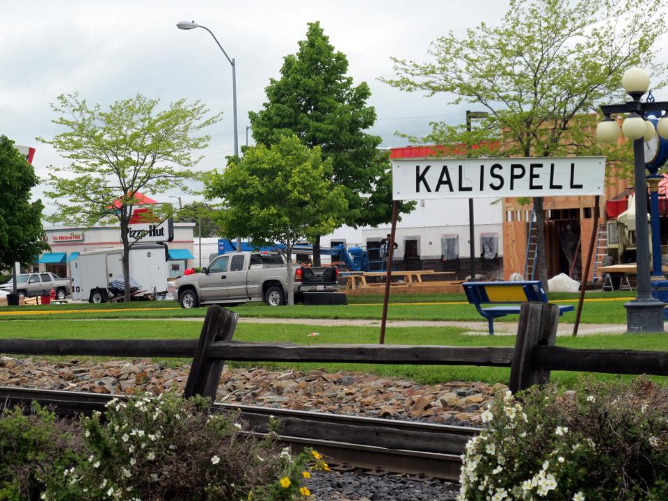 In this photo taken Thursday, June 16, 2011, a sign near an old railroad station is shown in Kalispell, Mont. Anti-government and white supremacist individuals and groups are thriving in the Inland Northwest, an area that runs roughly 200 miles from Spokane, Wash., through northern Idaho to this community on the outskirts of Glacier National Park. (AP Photo/Nicholas K. Geranios)