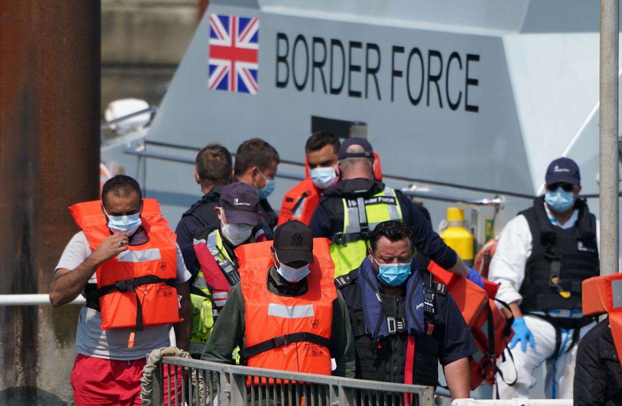 A group of people thought to be migrants are brought in to Dover (Gareth Fuller/PA) (PA Wire)