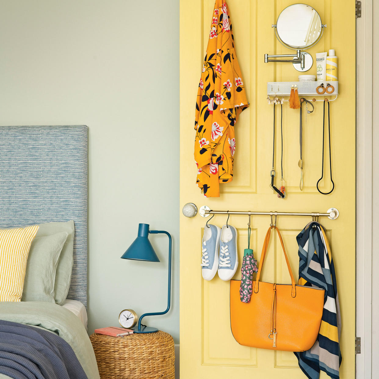  Bedroom with door storage and bedside table with lamp. 