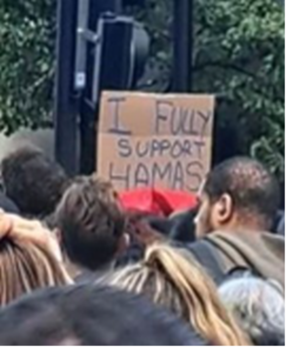 Police are also looking for a man who held a sign reading: 