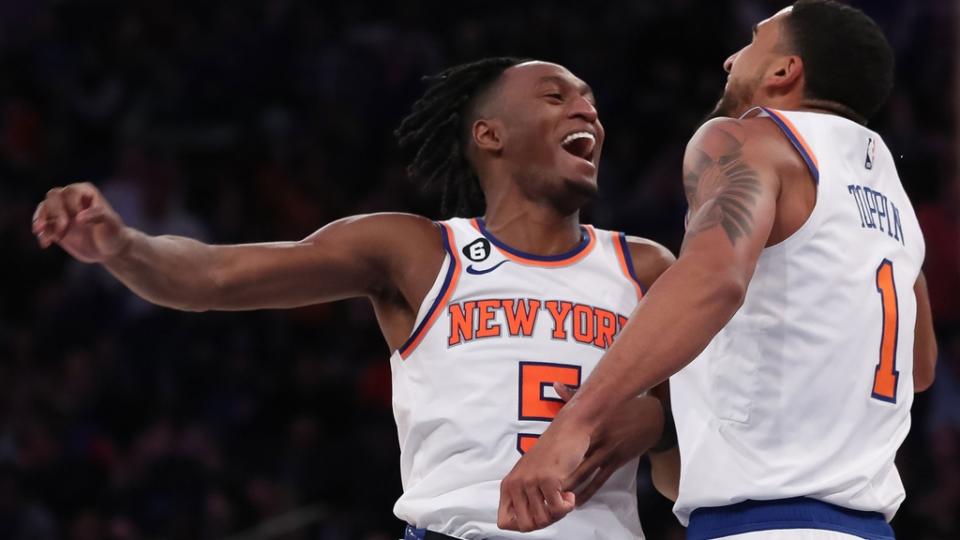 Oct 21, 2022; New York, New York, USA; New York Knicks guard Immanuel Quickley (5) celebrates with New York Knicks forward Obi Toppin (1) after a timeout against Detroit Pistons during the fourth quarter at Madison Square Garden.
