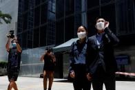 The Wider Image: On trial on riot charges, Hong Kong newlyweds prepared for life apart