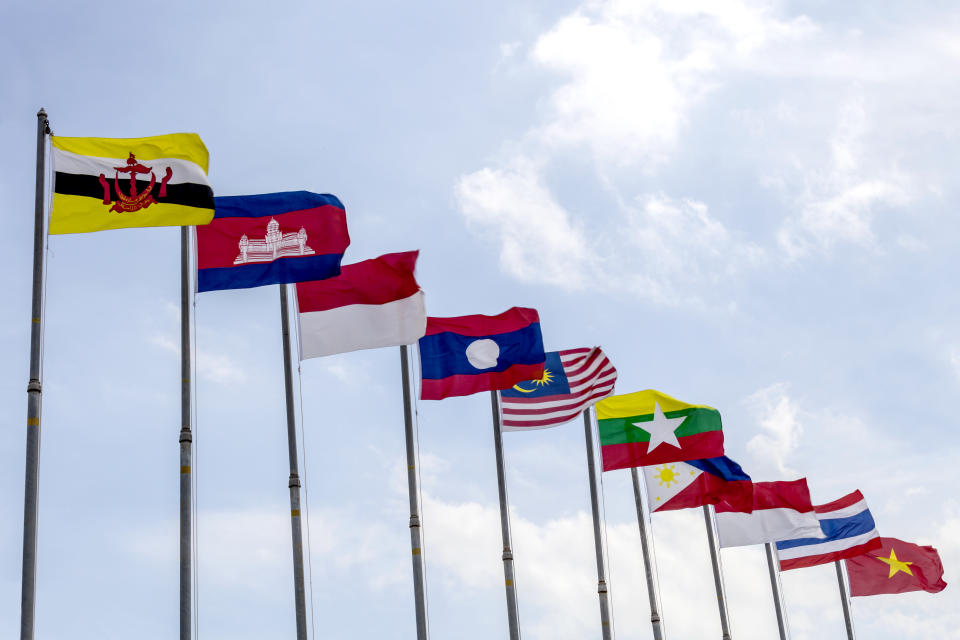 National flags of countries who are member of AEC (ASEAN economic community) on blue sky background