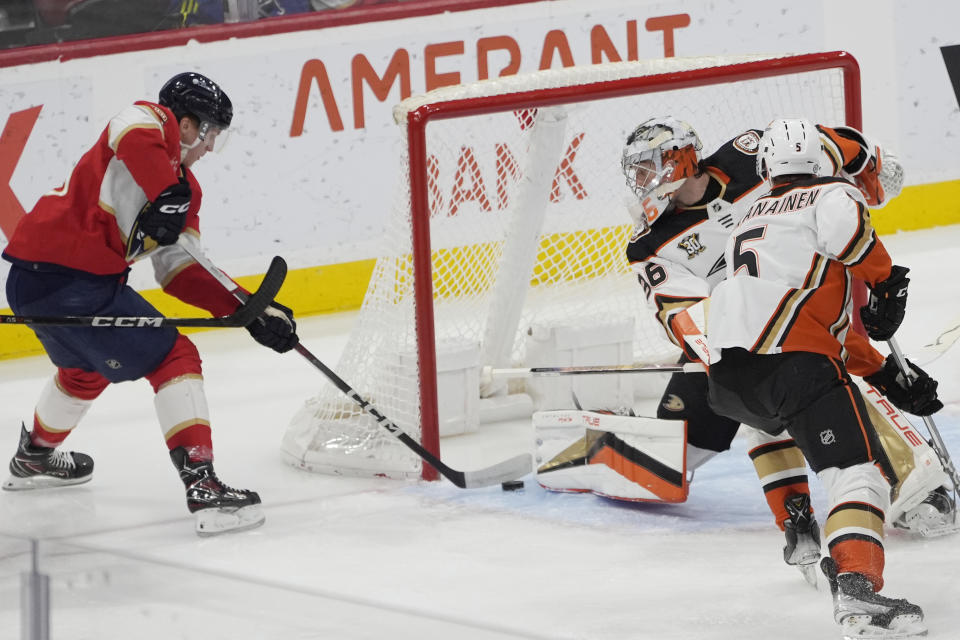 Florida Panthers center Anton Lundell (15) attempts a shot on goal as Anaheim Ducks goaltender John Gibson (36) defends the net during the first period of an NHL hockey game, Monday, Jan. 15, 2024, in Sunrise, Fla. (AP Photo/Marta Lavandier)