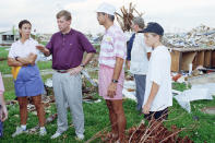 <p>Vice President Dan Quayle and wife Marilyn, left, talk with disaster relief worker Dan Forbes, center, at a site in Florida City, Fla., Sept. 12, 1992 where Hurricane Andrew ripped through a trailer park destroying everything in its path. Quayle toured areas South Florida as well as meeting with victims and military at tent city in Homestead for a roundtable discussion. (AP Photo/Kathy Willens) </p>