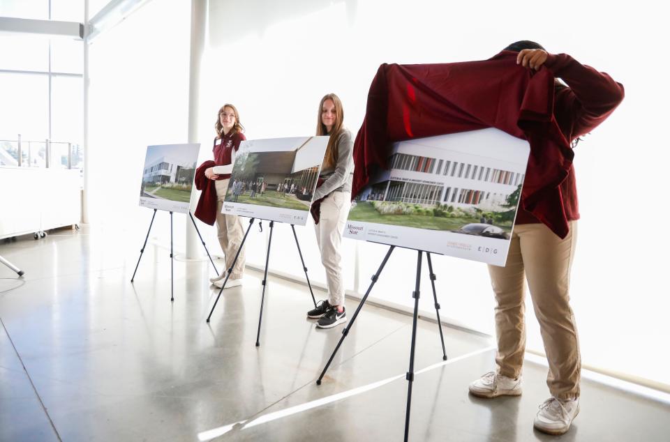A rendering for the the Clifton M. Smart III University Advancement Center is unveiled by a university ambassador on Friday, April 12, 2024.