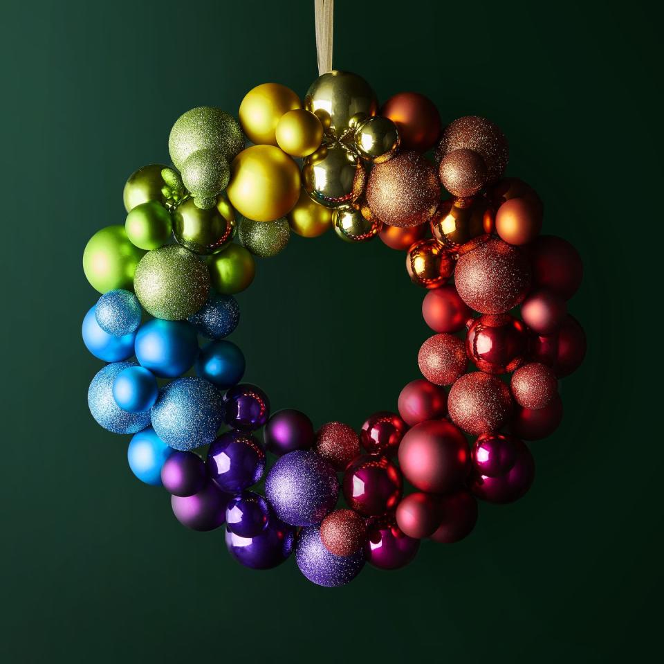 <p>If you can't be bold with decorating during Christmas, then when can you be? 'This eye-catching, rainbow-coloured shatterproof bauble wreath will be a firm family favourite,' say Waitrose.</p>