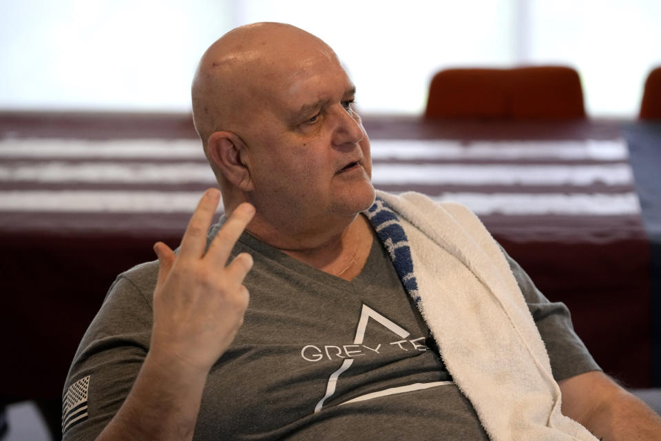 U.S. Navy veteran Bill Tolle, 60, talks about his experiences after a workout session at the Grey Team veterans center, Wednesday, May 17, 2023, in Boca Raton, Fla. The center is helping veterans with post-traumatic stress disorder and other mental and physical ailments get back into the civilian world. (AP Photo/Lynne Sladky)