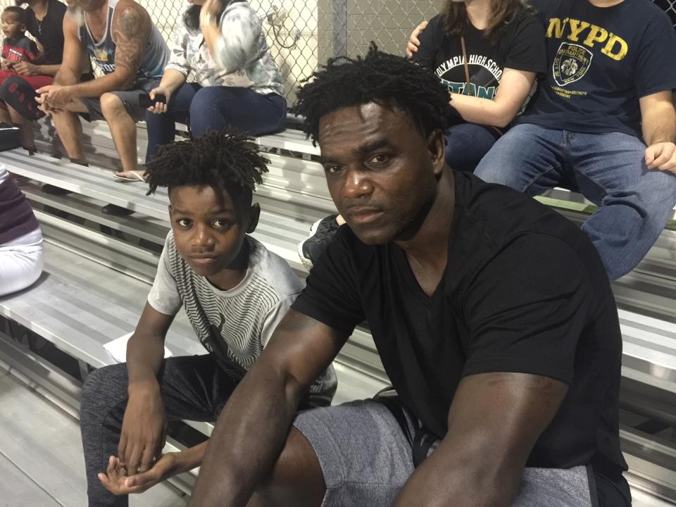 Edgerrin James, pictured with his son Edgerrin Jr., has helped his hometown recover from a natural disaster. (Yahoo Sports) 